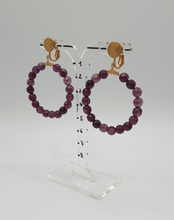 Load image into Gallery viewer, golden metal clip-on earrings with purple agate beads
