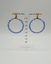 Load image into Gallery viewer, golden metal clip-on earrings with facetted blue jade beads
