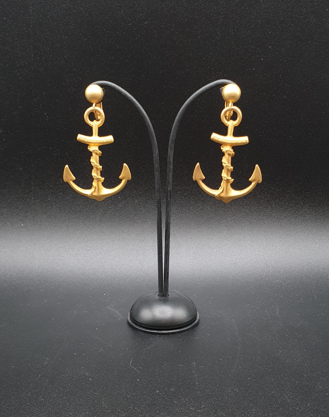 golden metal clip-on earrings with anchors