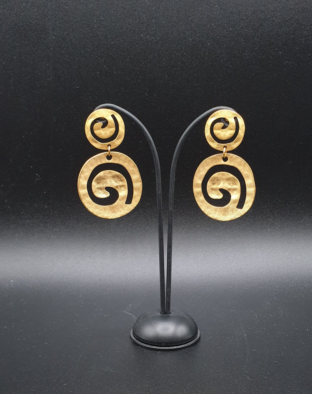 golden metal stud earrings with two decorative circles