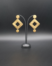 Load image into Gallery viewer, golden metal stud earrings with decorative square elements
