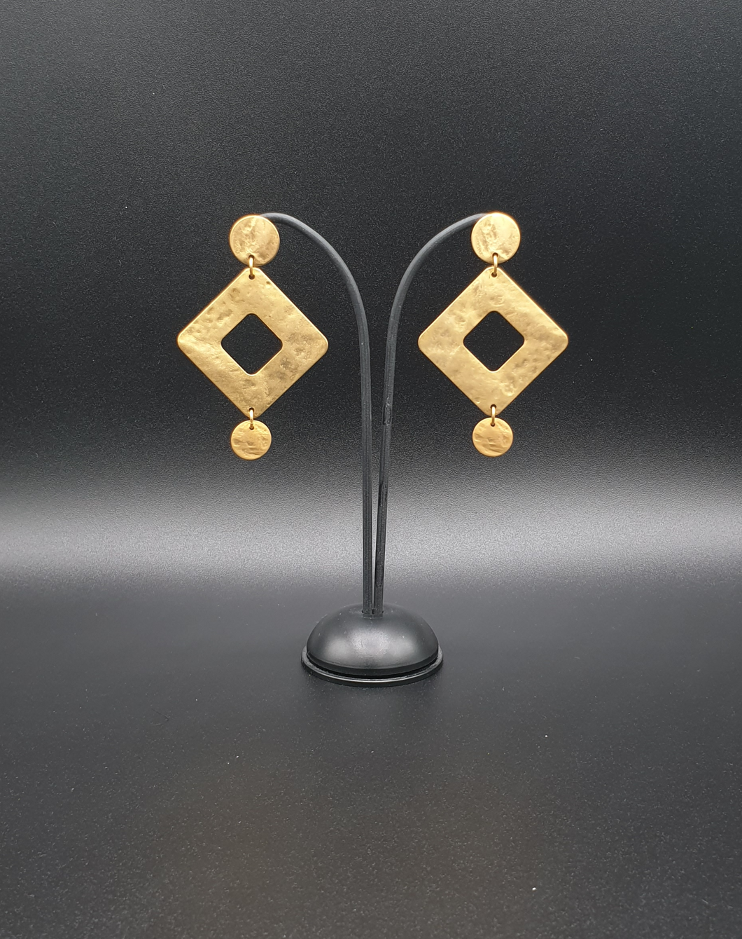 golden metal stud earrings with decorative square elements