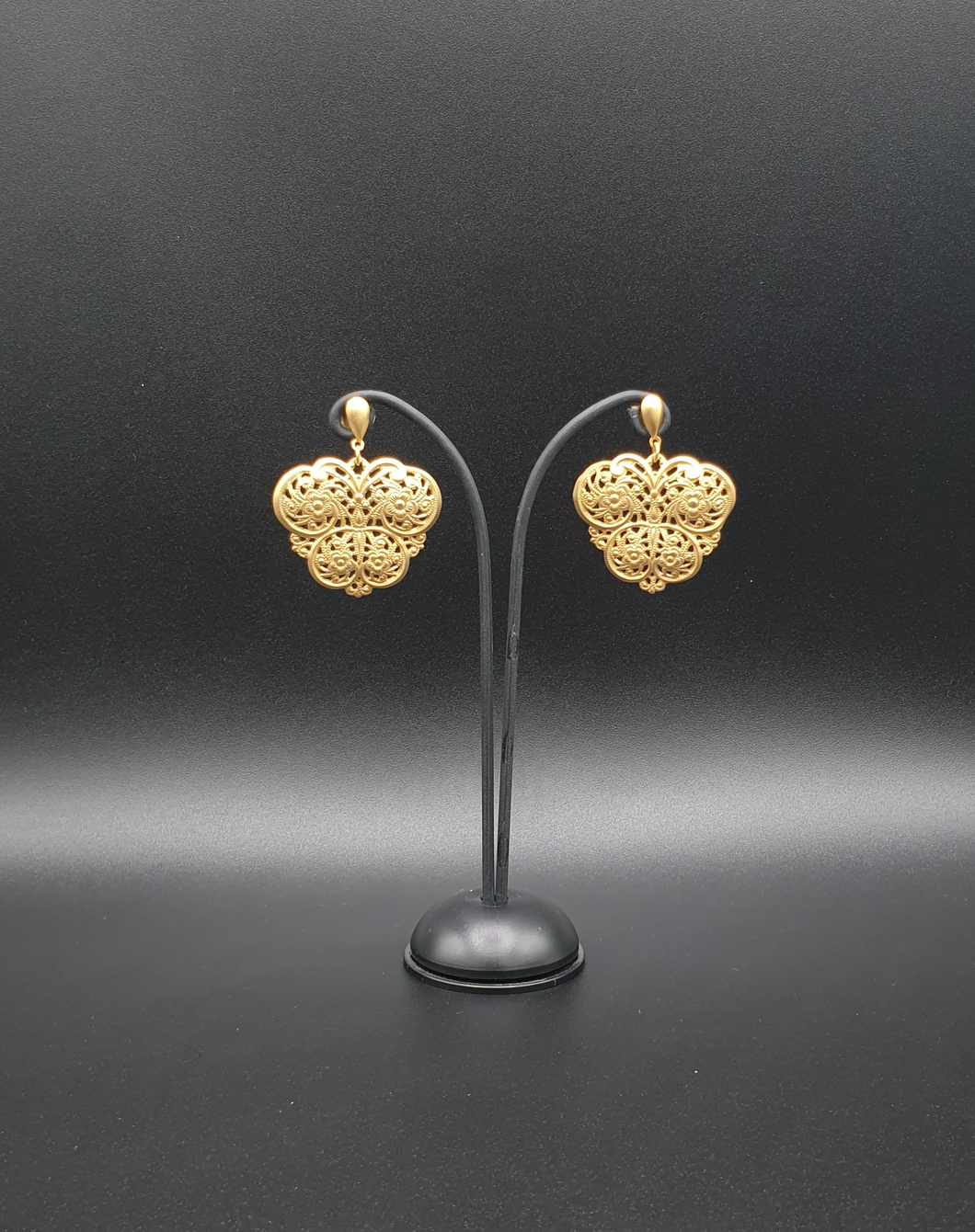 golden metal oval studs with butterfly-like element